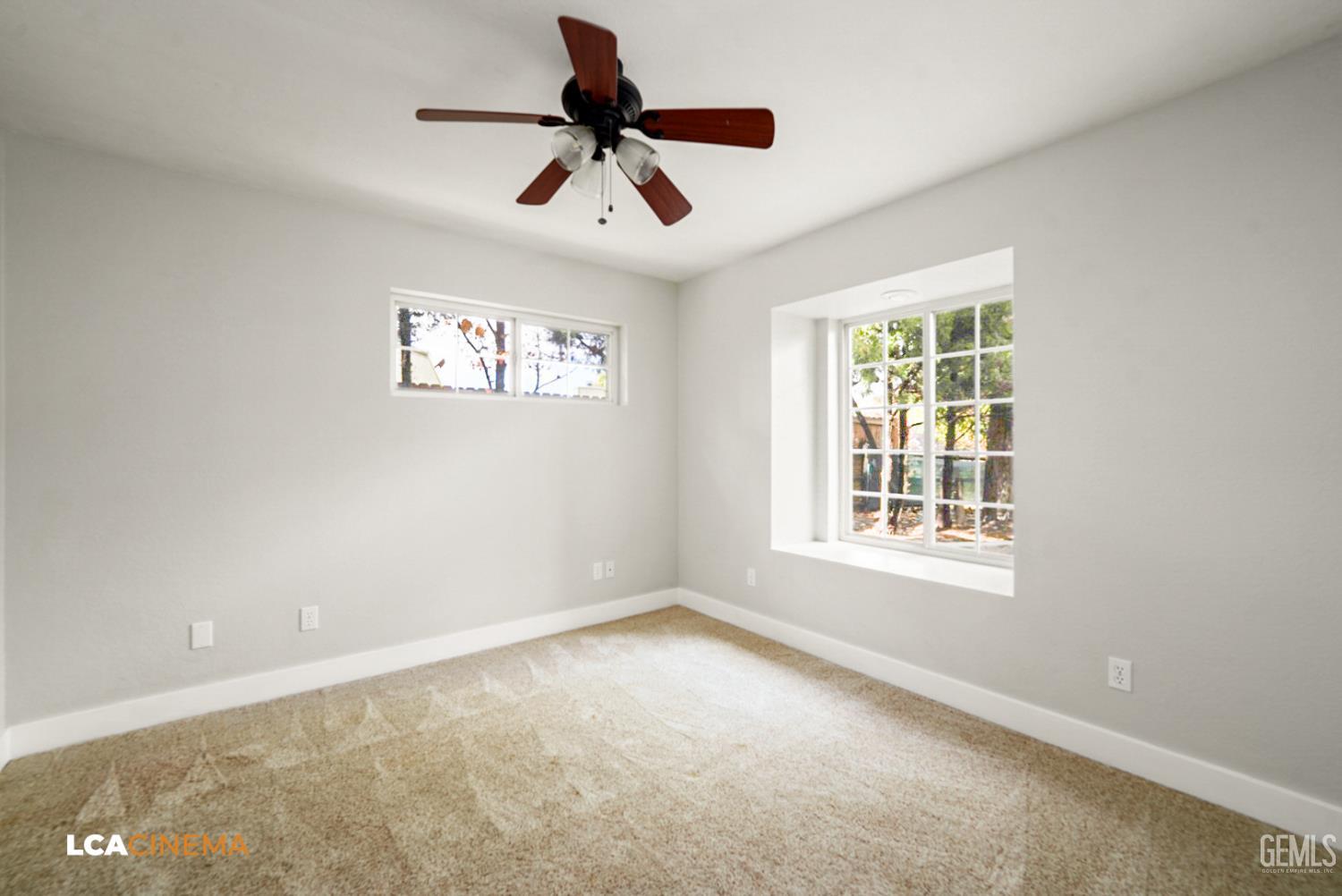 Undisclosed Address Tehachapi, CA 93561 - Photo 11 of 36 an empty room with ceiling fan and windows
