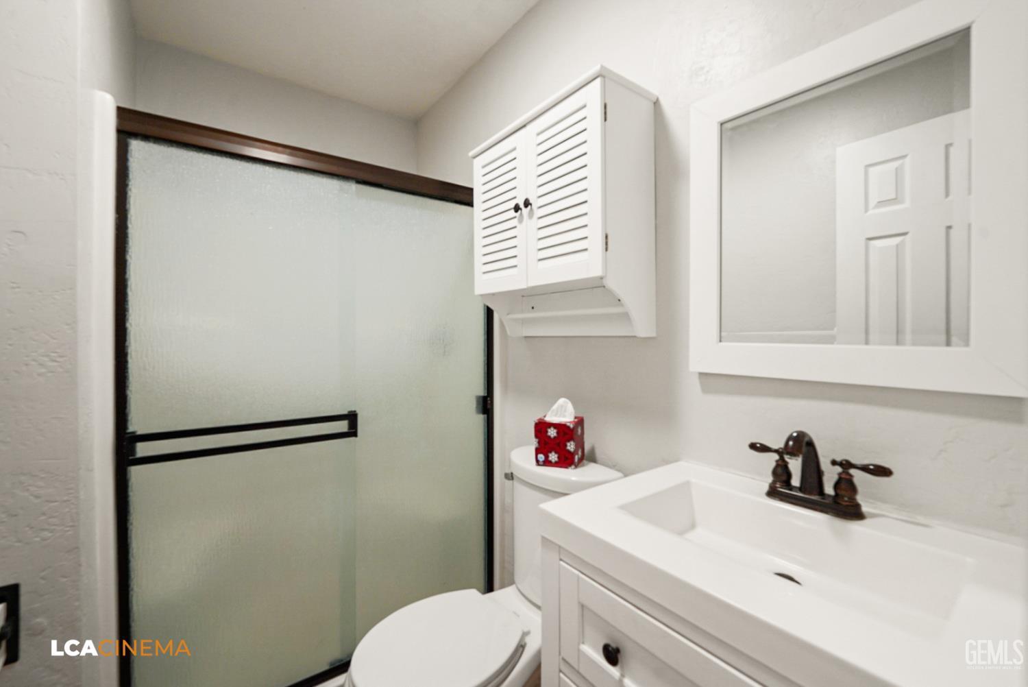 Undisclosed Address Tehachapi, CA 93561 - Photo 25 of 36 a bathroom with a sink and a mirror