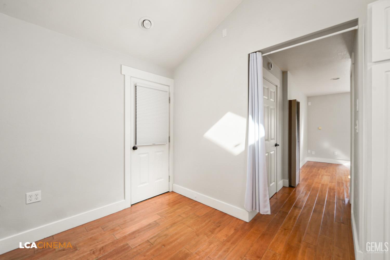 Undisclosed Address Tehachapi, CA 93561 - Photo 27 of 36 a view of a hallway with wooden floor