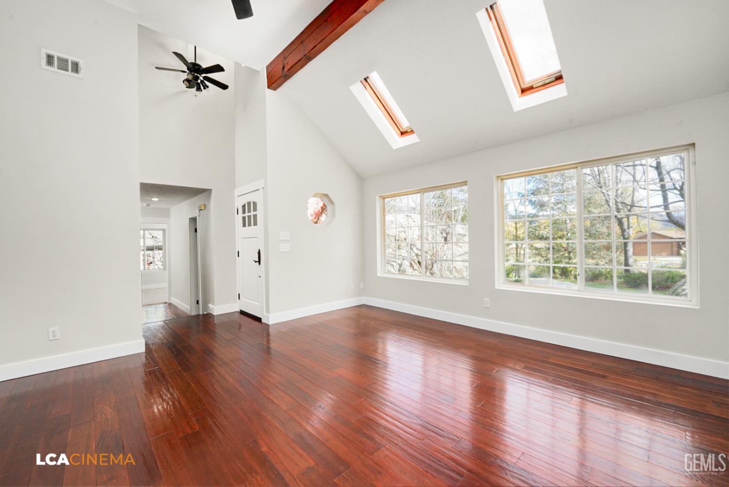 Undisclosed Address Tehachapi, CA 93561 - Photo 6 of 36 a view of an empty room with a window and wooden floor