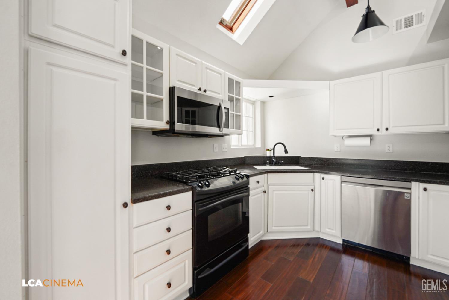 Undisclosed Address Tehachapi, CA 93561 - Photo 8 of 36 a kitchen with stainless steel appliances granite countertop a stove a sink and a microwave
