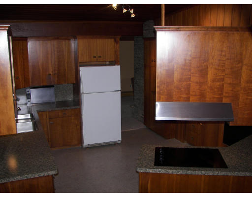 40 Old Post Road Walpole, MA 02032 - Photo 11 of 30 a kitchen with a refrigerator and cabinets