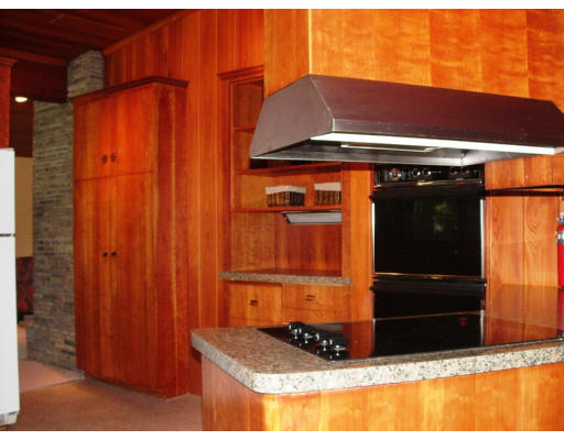 40 Old Post Road Walpole, MA 02032 - Photo 15 of 30 a black refrigerator freezer sitting in a kitchen