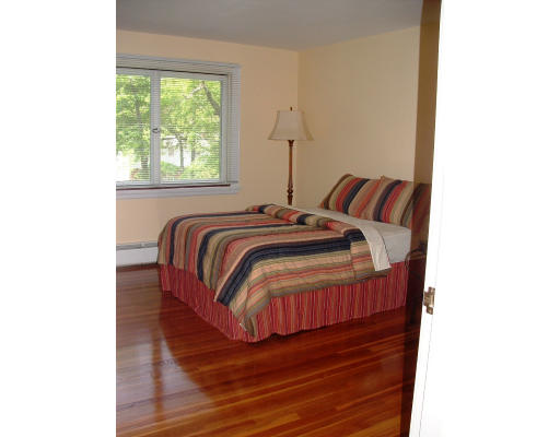 40 Old Post Road Walpole, MA 02032 - Photo 24 of 30 a bed sitting in a bedroom next to a window