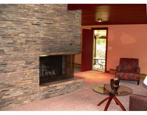 40 Old Post Road Walpole, MA 02032 - Photo 6 of 30 a living room with furniture a fireplace and a flat screen tv