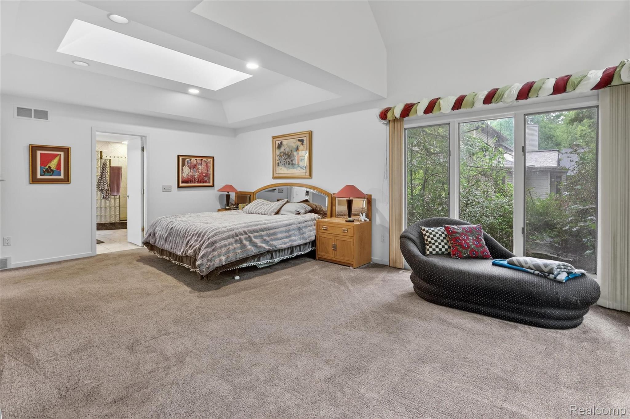 2197 South State Road Davison, MI 48423 - Photo 26 of 72 Spacious room featuring vaulted ceilings with a skylight, recessed lighting, and expansive windows