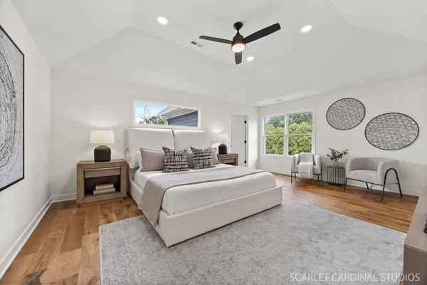a living room with bed furniture and a window