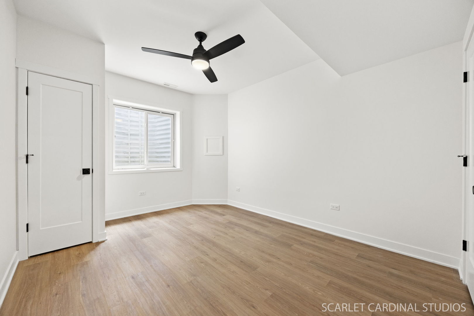 717 North Brainard Street Naperville, IL 60563 - Photo 35 of 49 a view of a livingroom with a hardwood floor and a ceiling fan