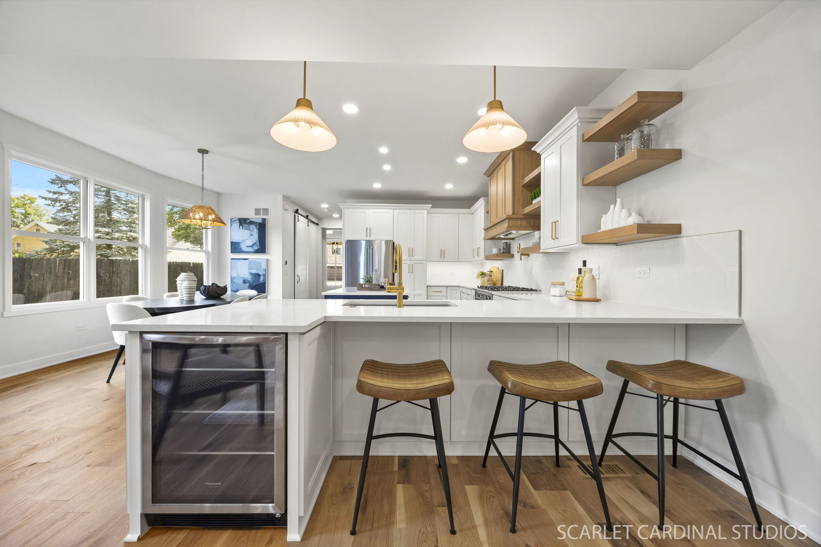 717 North Brainard Street Naperville, IL 60563 - Photo 7 of 49 a kitchen with stainless steel appliances granite countertop a stove a sink island with a dining table and chairs