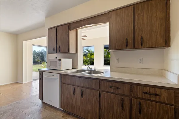 a kitchen with a sink and cabinets