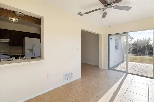 a view of a hallway with a flat screen tv