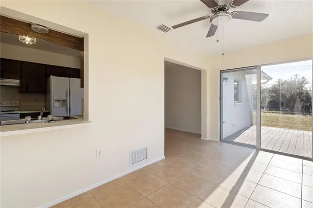 a view of a hallway with a flat screen tv