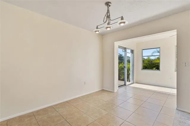 a view of an empty room with glass door