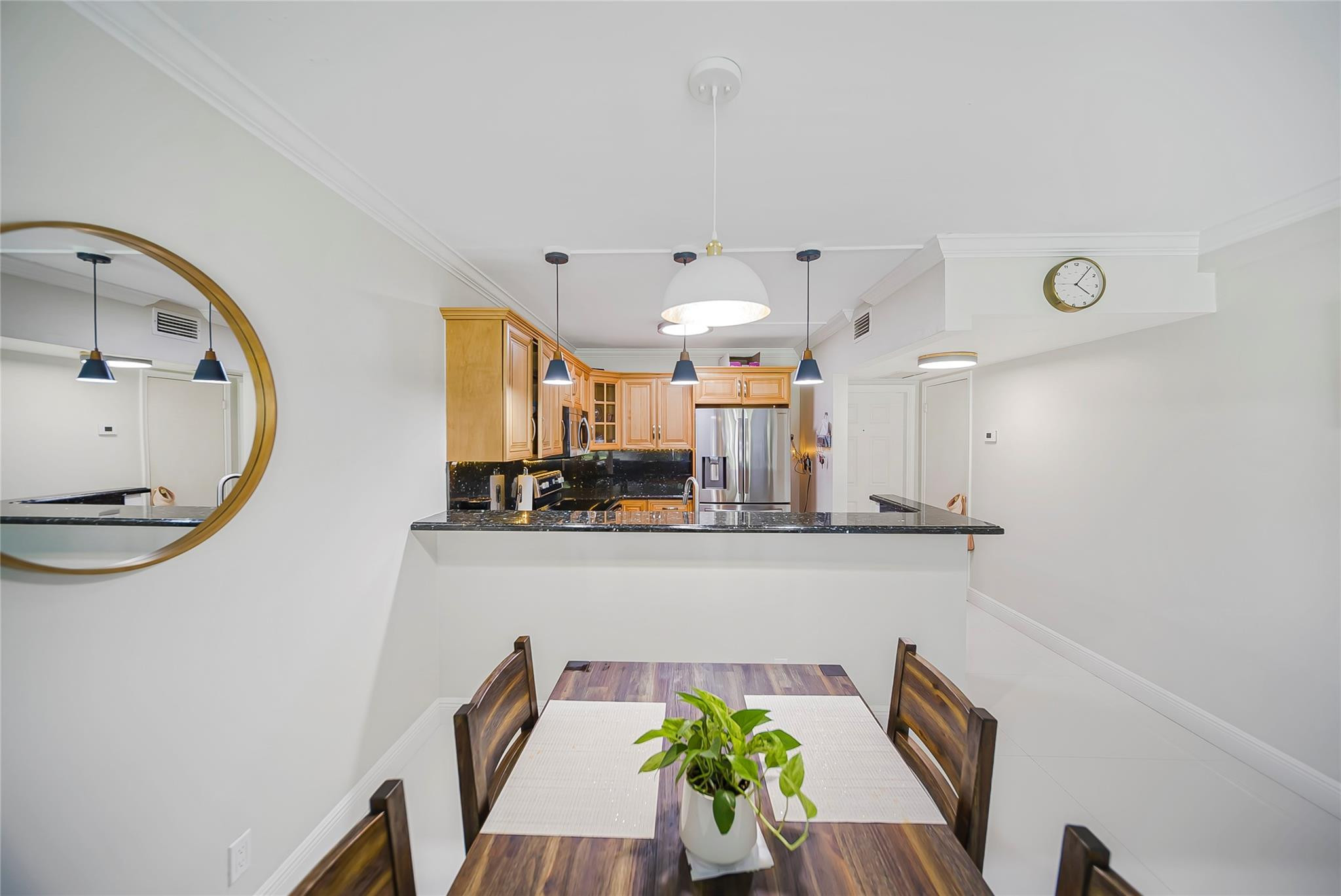 Undisclosed Address Deerfield Beach, FL 33441 - Photo 12 of 26 a dining room with furniture and a mirror