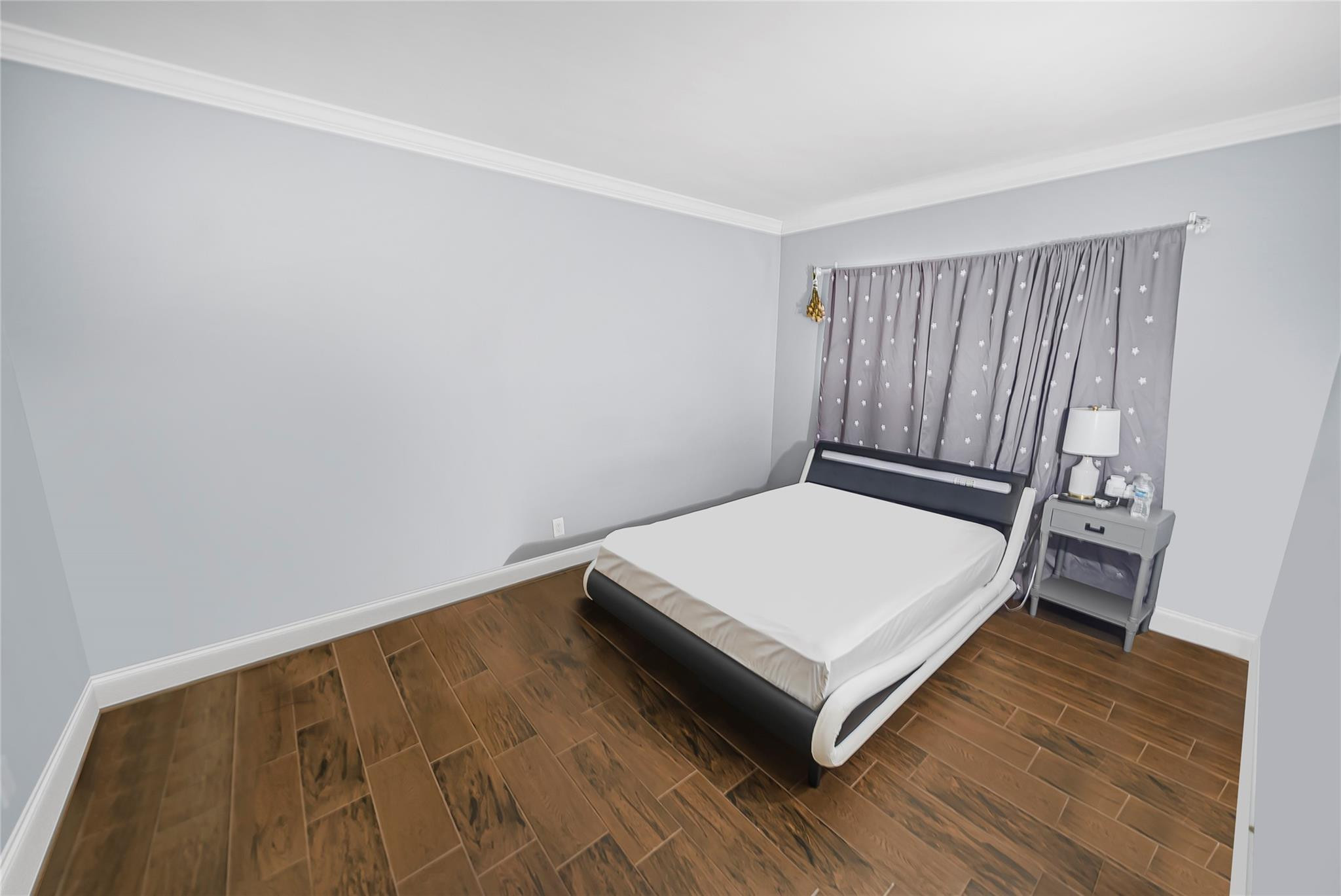 Undisclosed Address Deerfield Beach, FL 33441 - Photo 25 of 26 a bed sitting in a bedroom next to a window