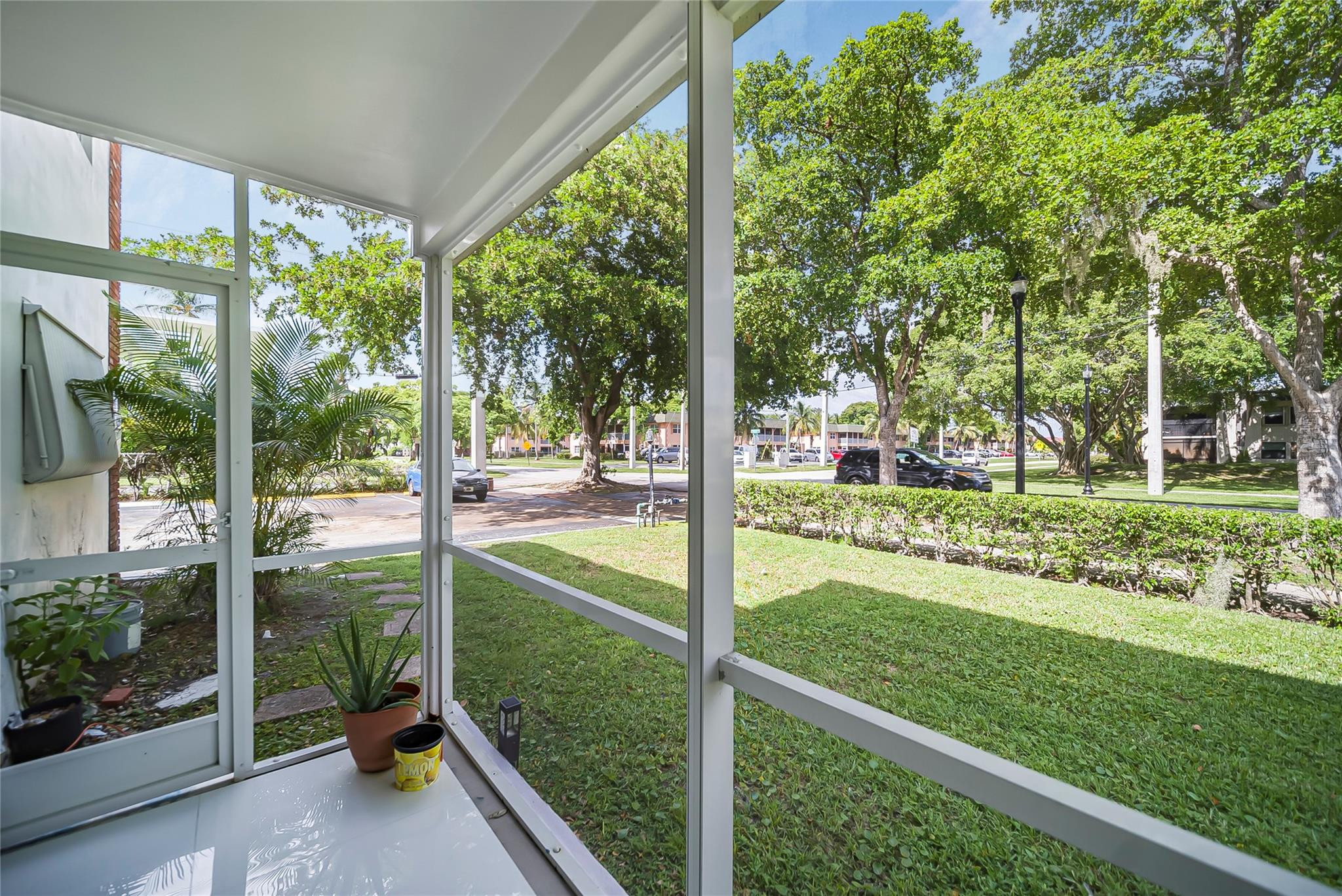 Undisclosed Address Deerfield Beach, FL 33441 - Photo 6 of 26 a view of a garden from a porch