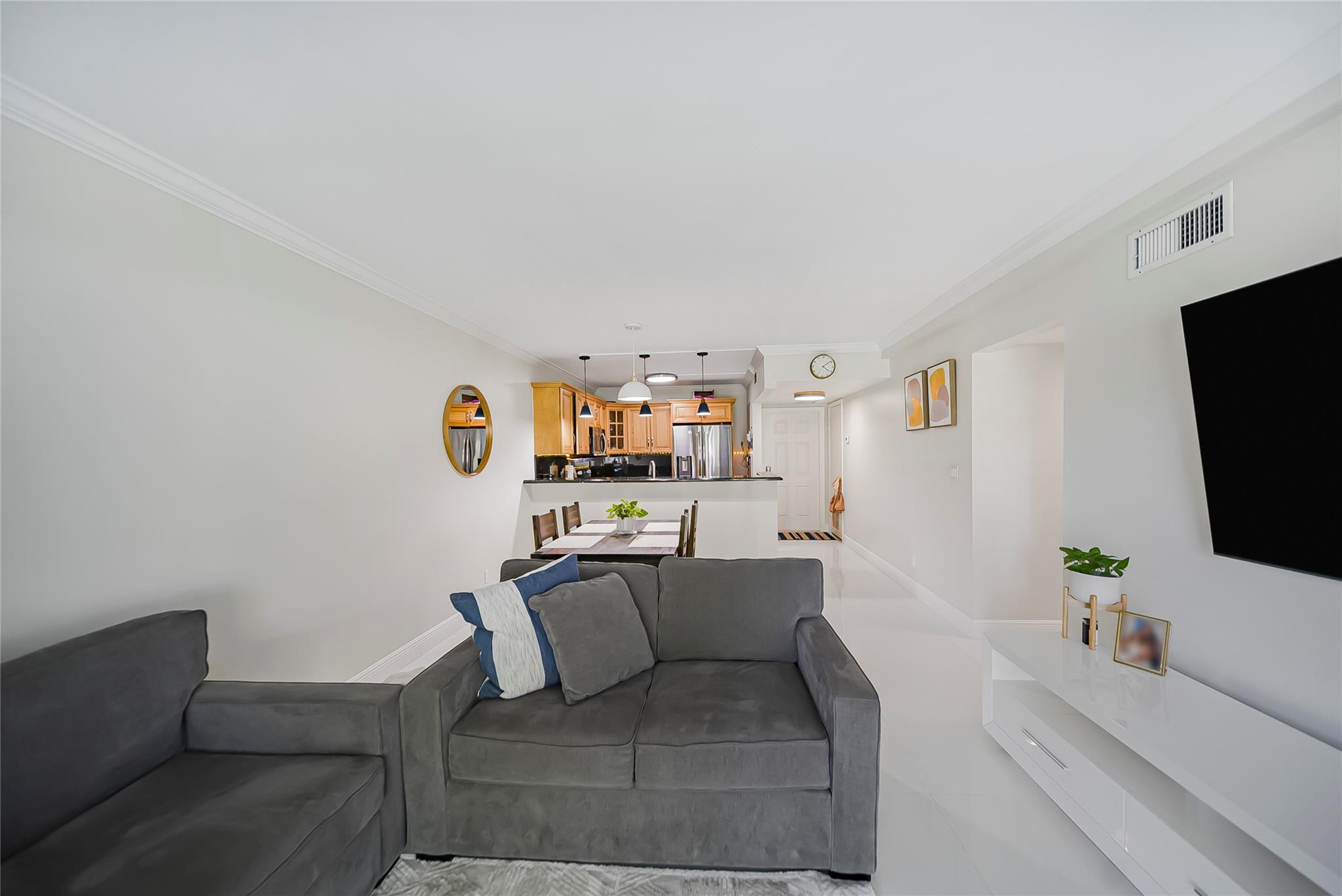 Undisclosed Address Deerfield Beach, FL 33441 - Photo 7 of 26 a living room with furniture and a flat screen tv