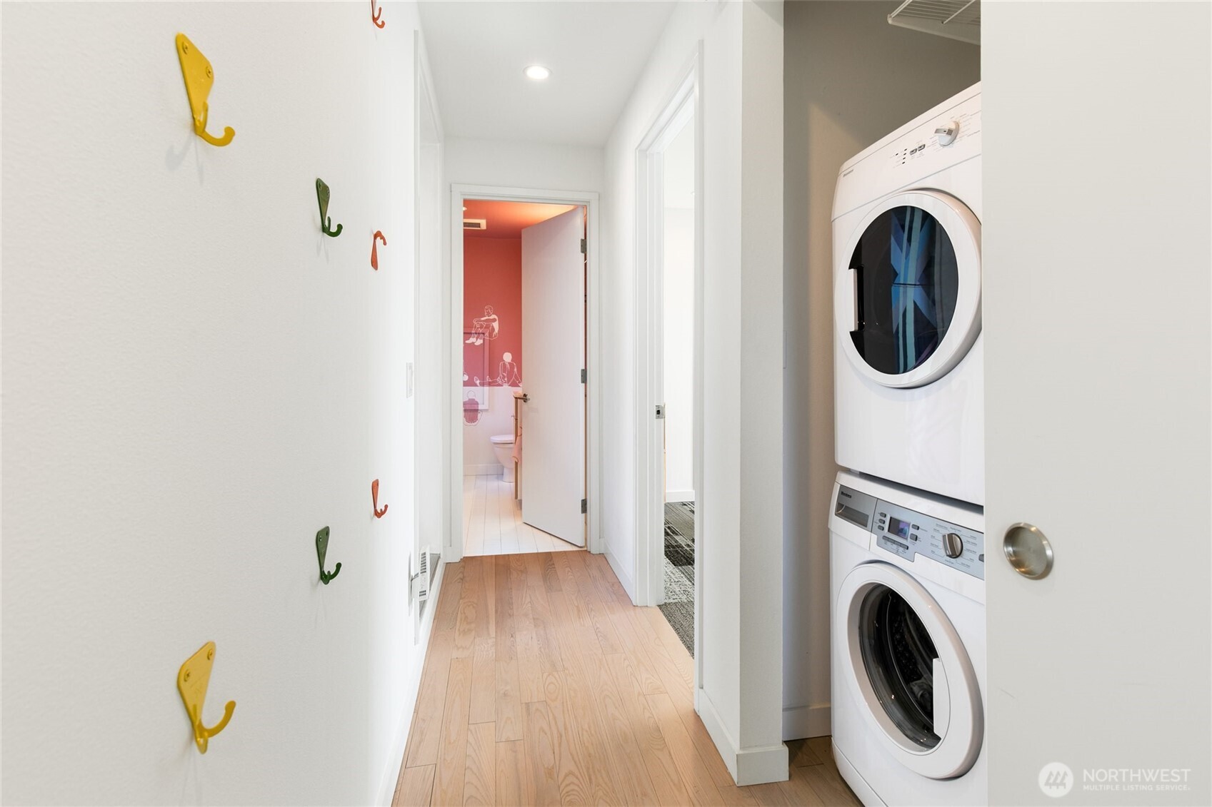 716 16th Avenue, Unit C Seattle, WA 98122 - Photo 21 of 40 a view of a hallway with washer and dryer