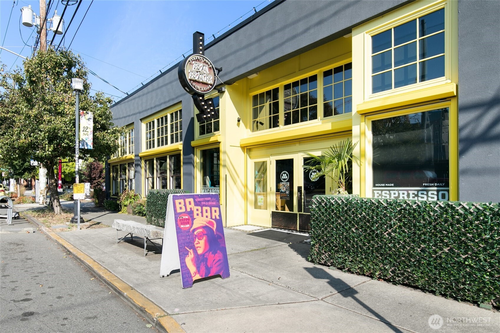 716 16th Avenue, Unit C Seattle, WA 98122 - Photo 40 of 40 a front view of a building with retail shops