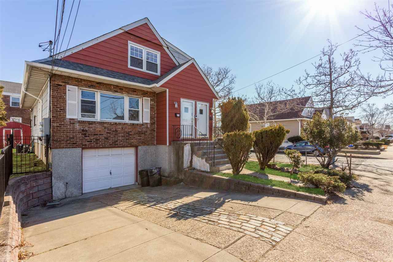 78 Country Village Road Jersey City, NJ 07305 - Photo 1 of 1 a front view of a house with a yard