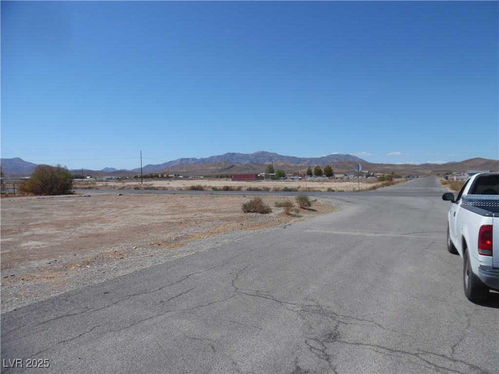4480 Retread Road Pahrump, NV 89048 - Photo 5 of 6 View of asphalt street featuring a mountain view and a view of rural / pastoral area