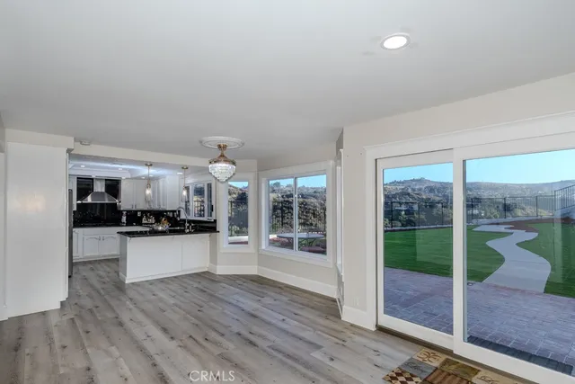 a kitchen with sink refrigerator and stove