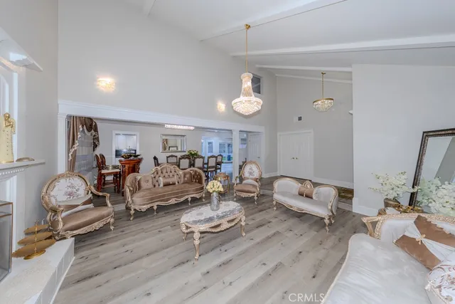 a living room with lots of furniture and a wooden floor