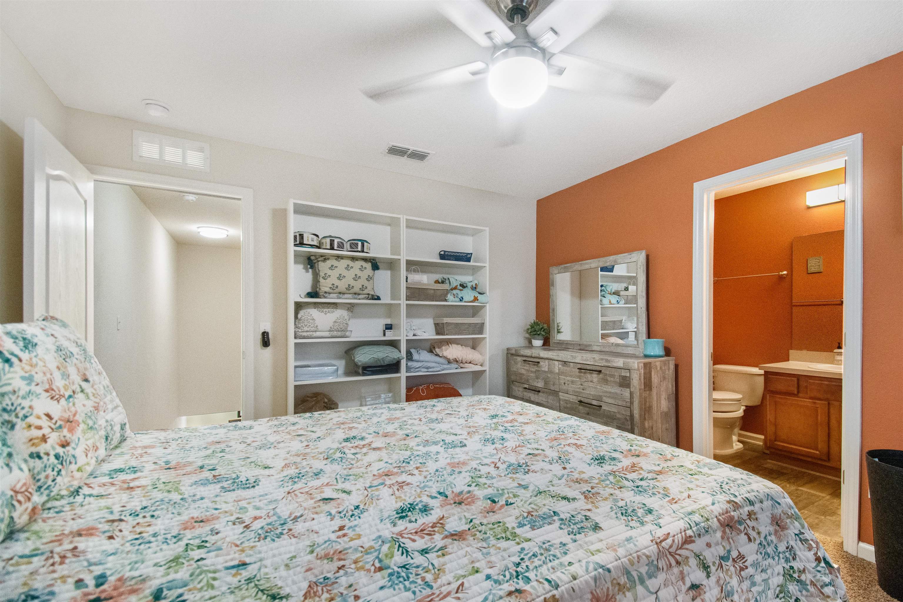 39 Whitland Way St. Augustine, FL 32086 - Photo 15 of 29 a bedroom with a large bed and a flat tv screen on dresser