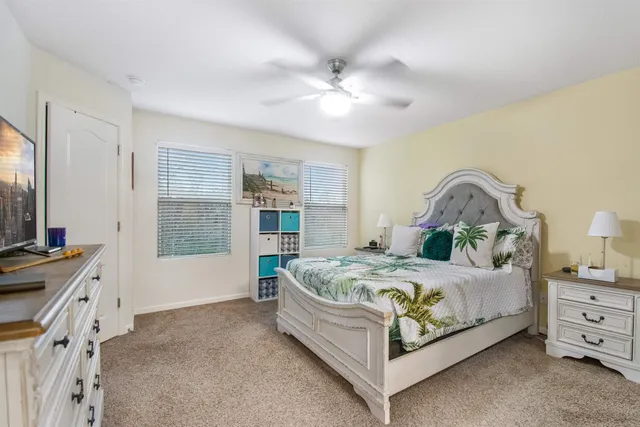 a bedroom with a bed and a dresser