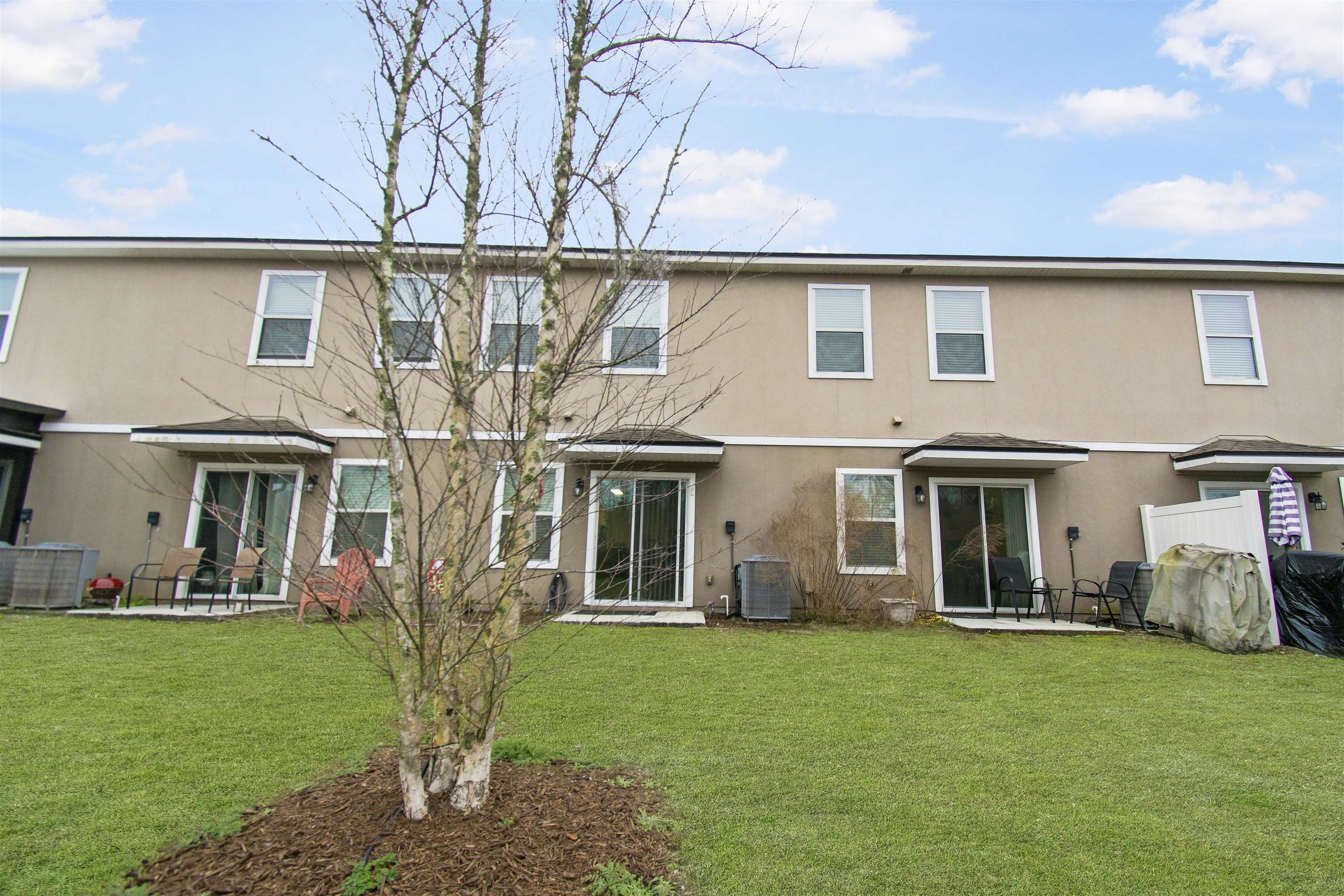39 Whitland Way St. Augustine, FL 32086 - Photo 27 of 29 a front view of a house with a garden and plants