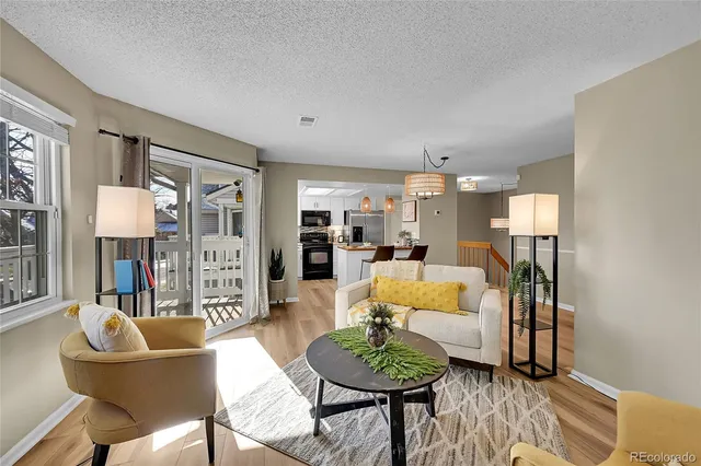 a living room with furniture and a table