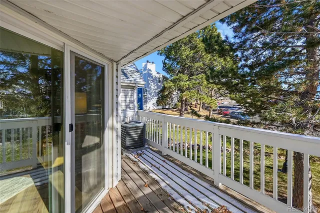 a view of a balcony with wooden floor