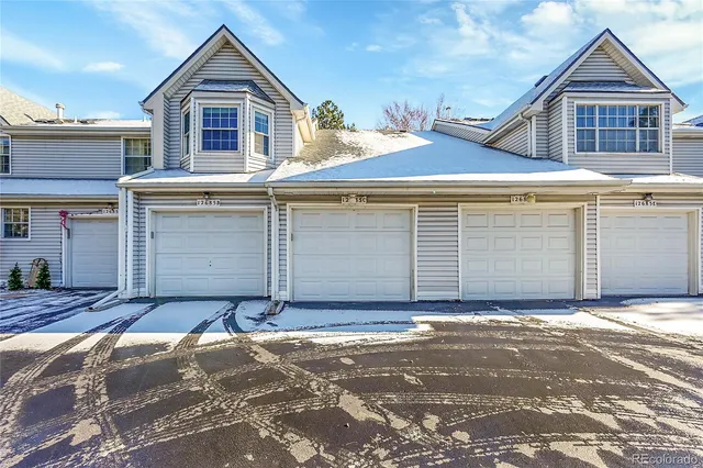 a front view of a house with a garage