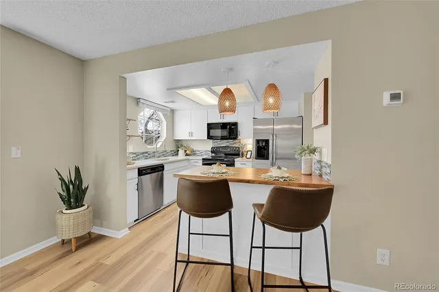 a kitchen with a table and chairs in it