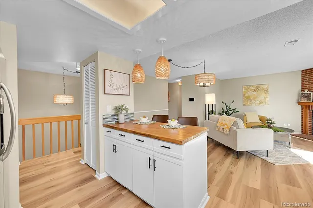 a view of living room with furniture and wooden floor