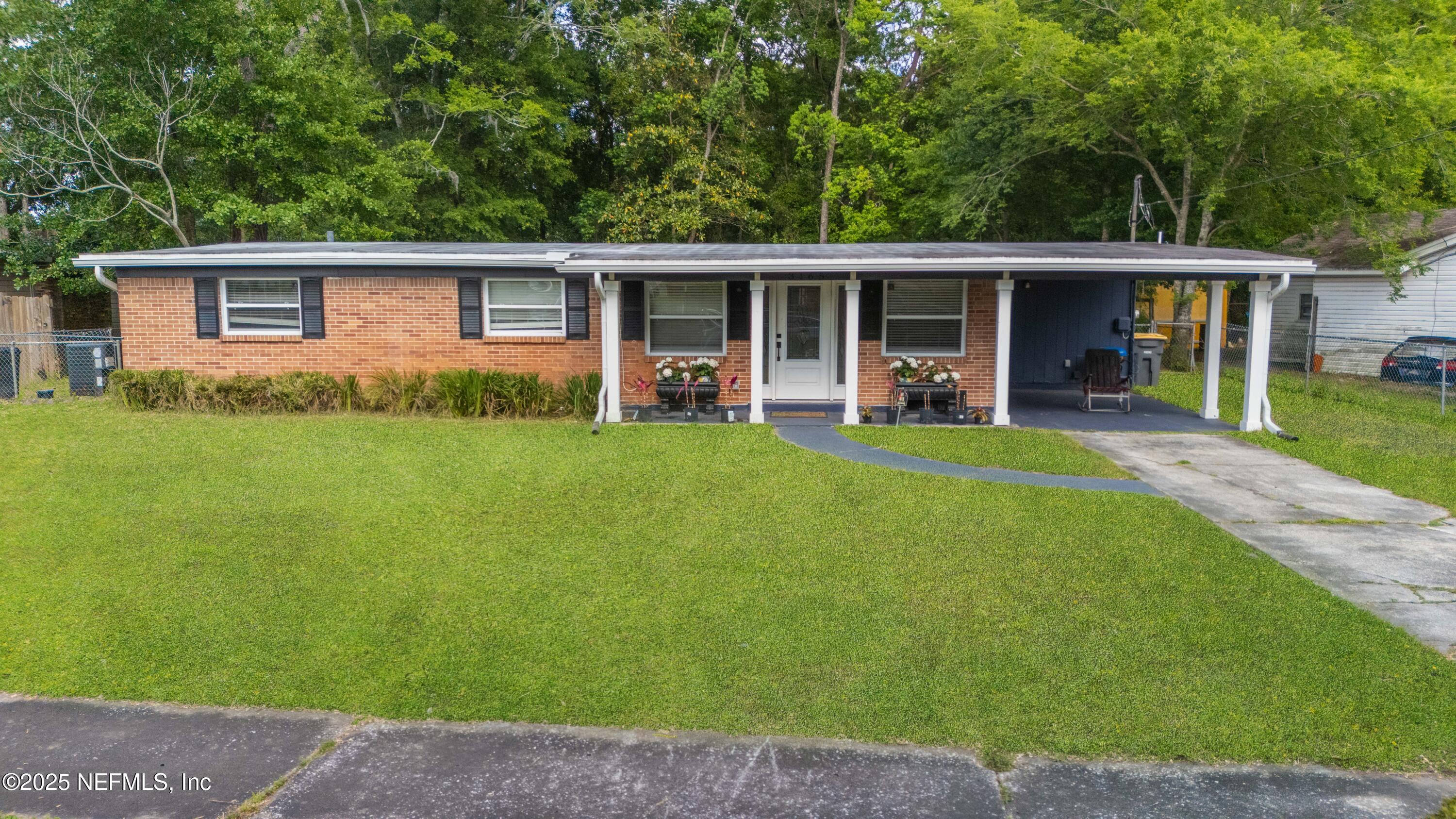 front view of a house with a yard