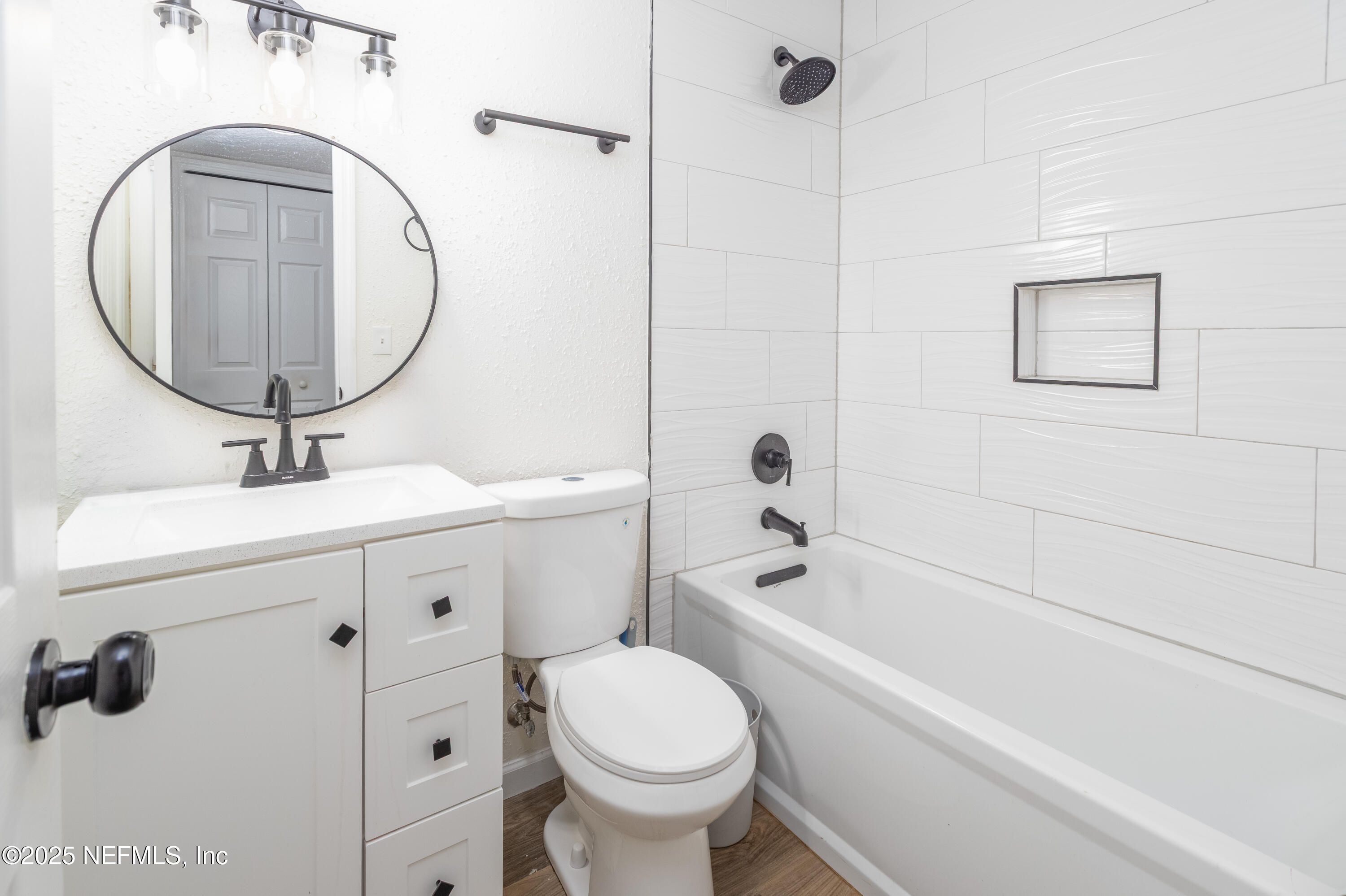 3165 Victoria Park Road Jacksonville, FL 32216 - Photo 15 of 22 a bathroom with a sink toilet and shower
