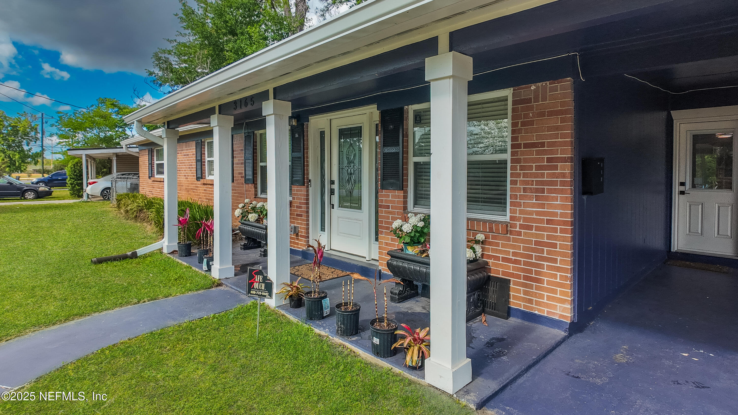 3165 Victoria Park Road Jacksonville, FL 32216 - Photo 2 of 22 a front view of a house with a yard