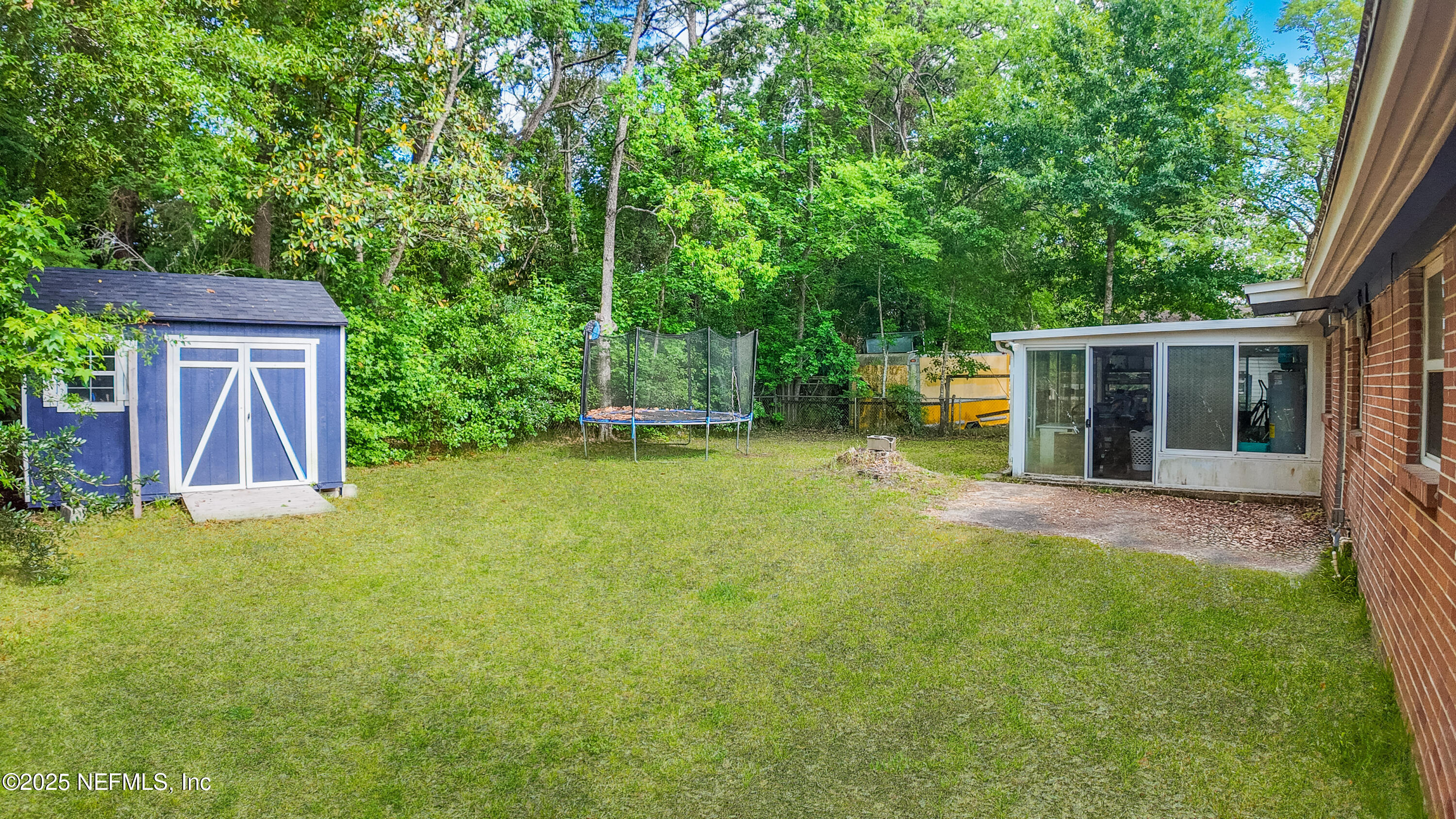 3165 Victoria Park Road Jacksonville, FL 32216 - Photo 21 of 22 a view of a house with backyard and sitting area