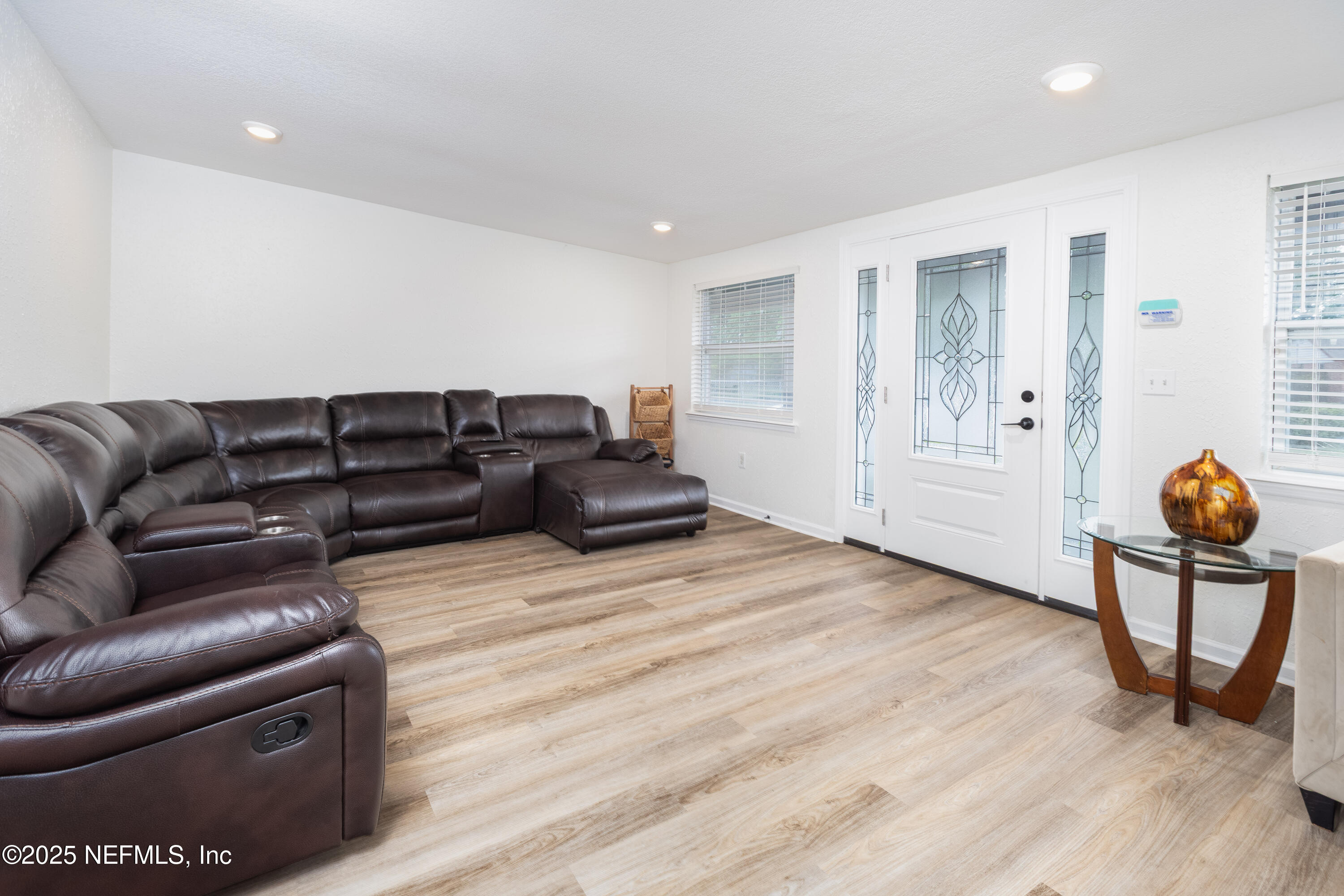 3165 Victoria Park Road Jacksonville, FL 32216 - Photo 3 of 22 a living room with furniture and wooden floor