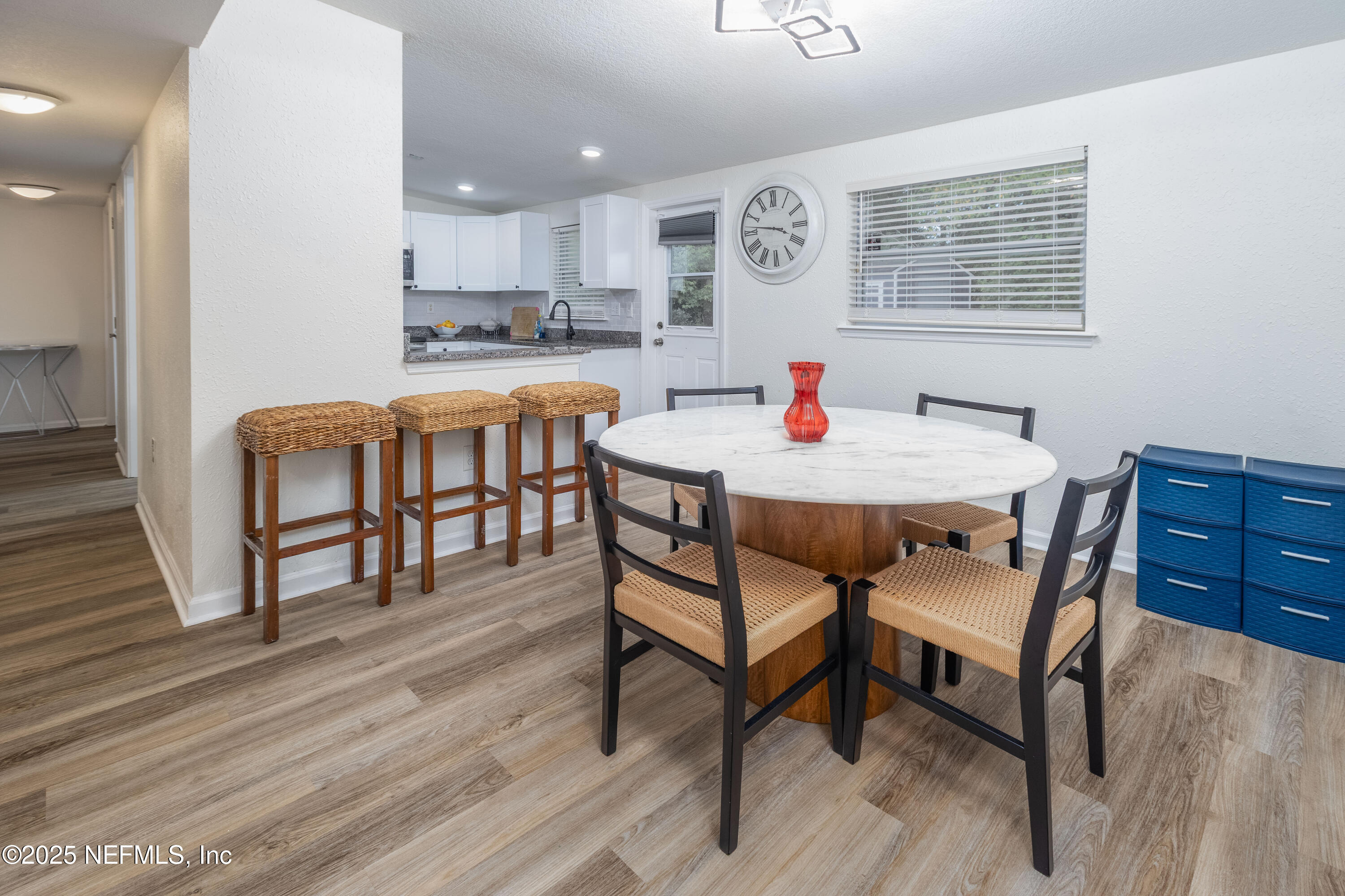 3165 Victoria Park Road Jacksonville, FL 32216 - Photo 9 of 22 a view of a dining room with furniture and wooden floor