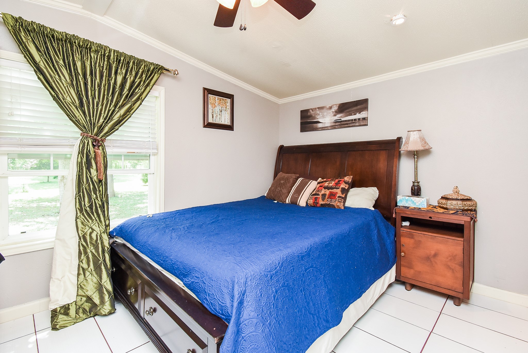 39551 Donigan Road Brookshire, TX 77423 - Photo 25 of 37 Bedroom featuring light tile patterned floors, ceiling fan, and crown molding