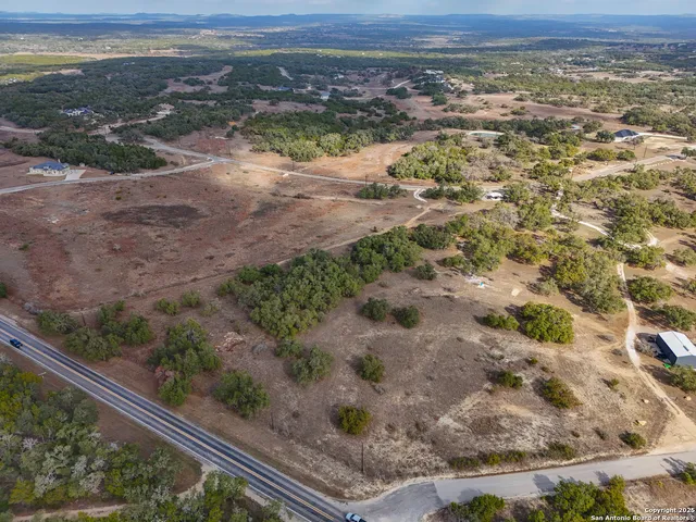 an aerial view of house with yard