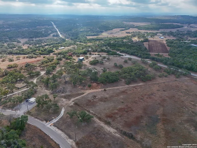 an aerial view of houses with yard