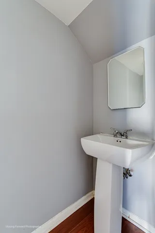 a bathroom with a sink and mirror