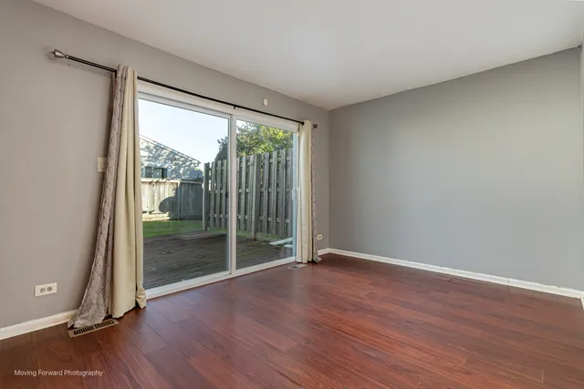 a view of wooden floor and brick walls