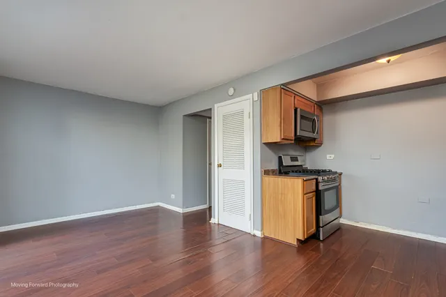 a room with wooden floor and a couch