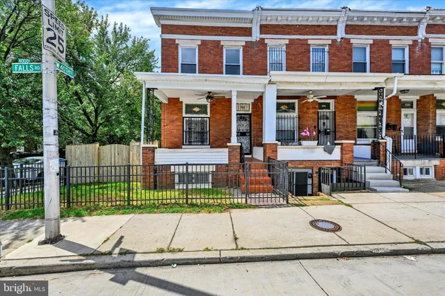 front view of a building with a garden