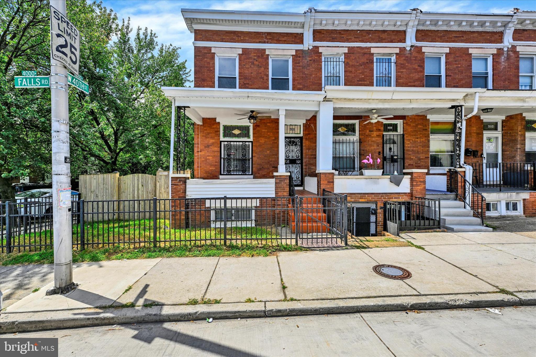 front view of a building with a garden