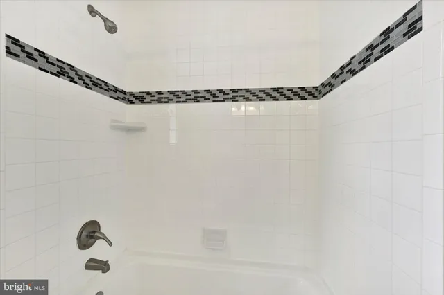 a bathroom with a shower and a shower